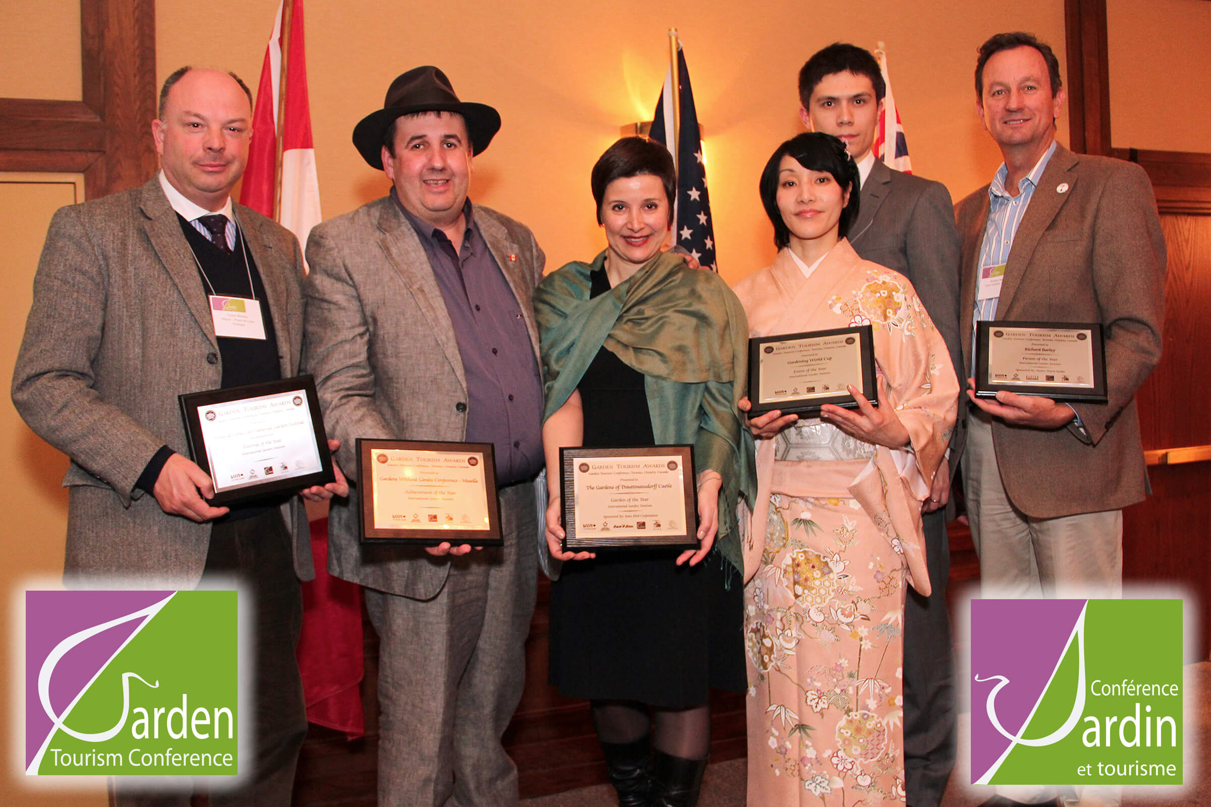 Recipients on stage receiving awards for tourism