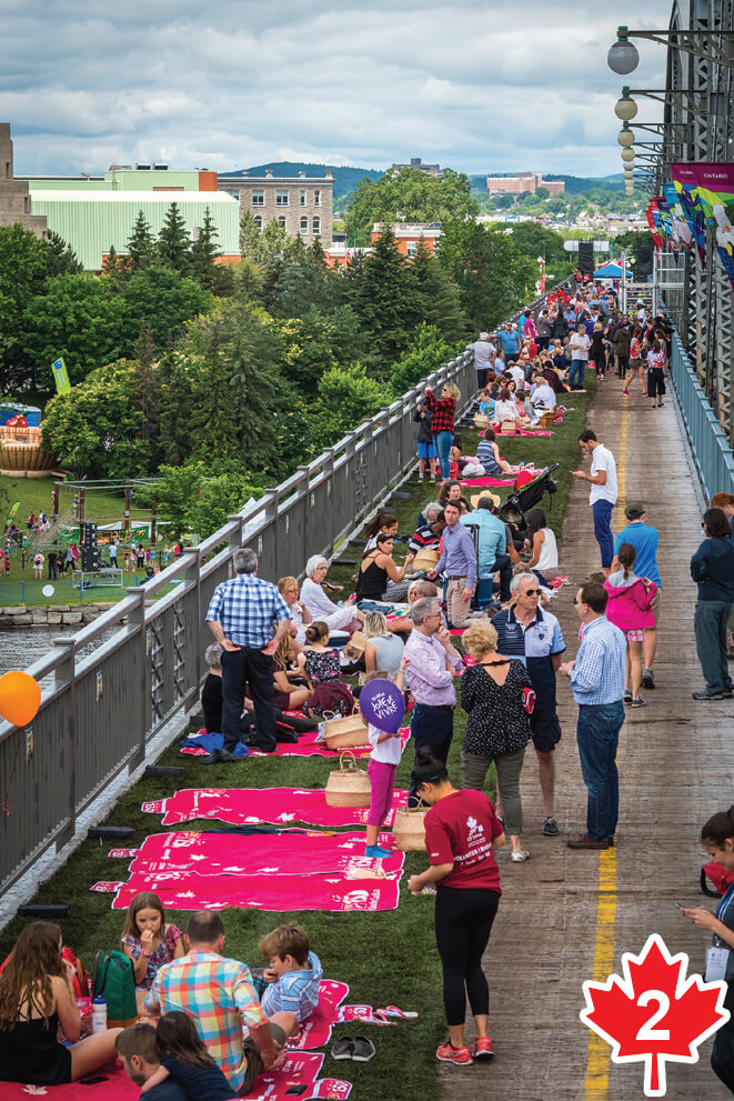 People having a picnic on a bridge