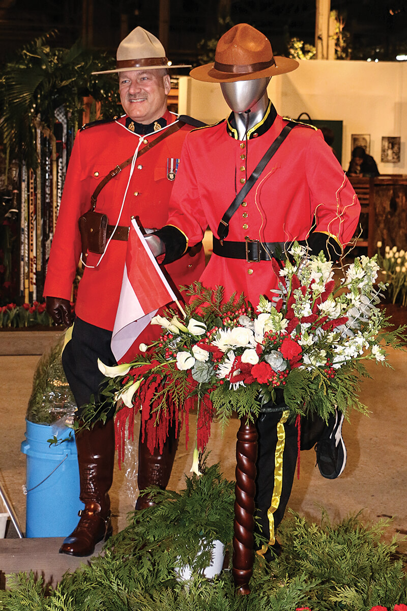 canadian mountie in uniform beside a floral mountie