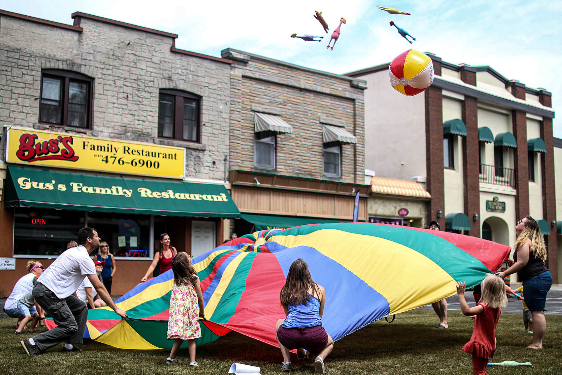 people playing with a parachute