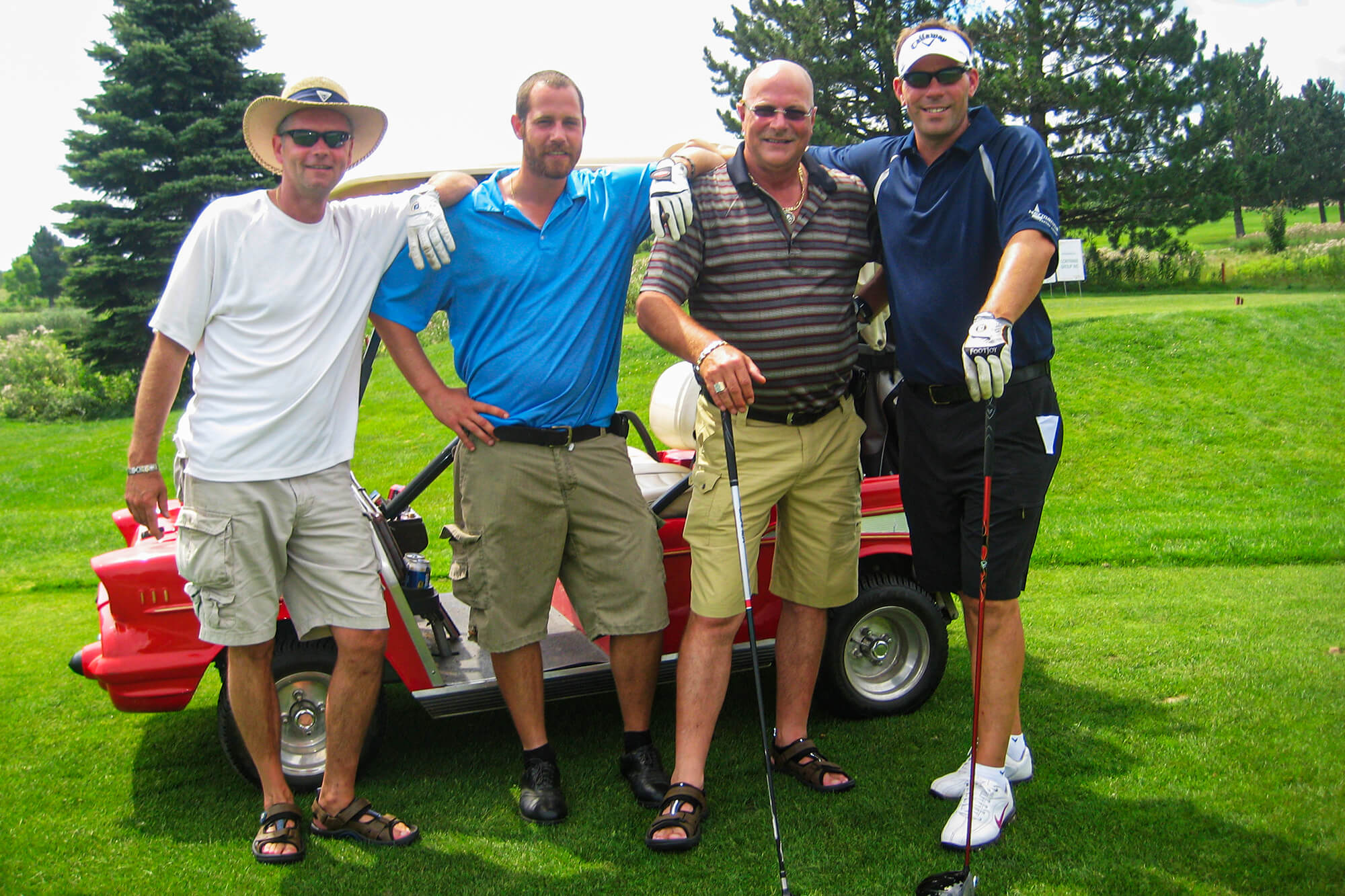 4 men on a golf course