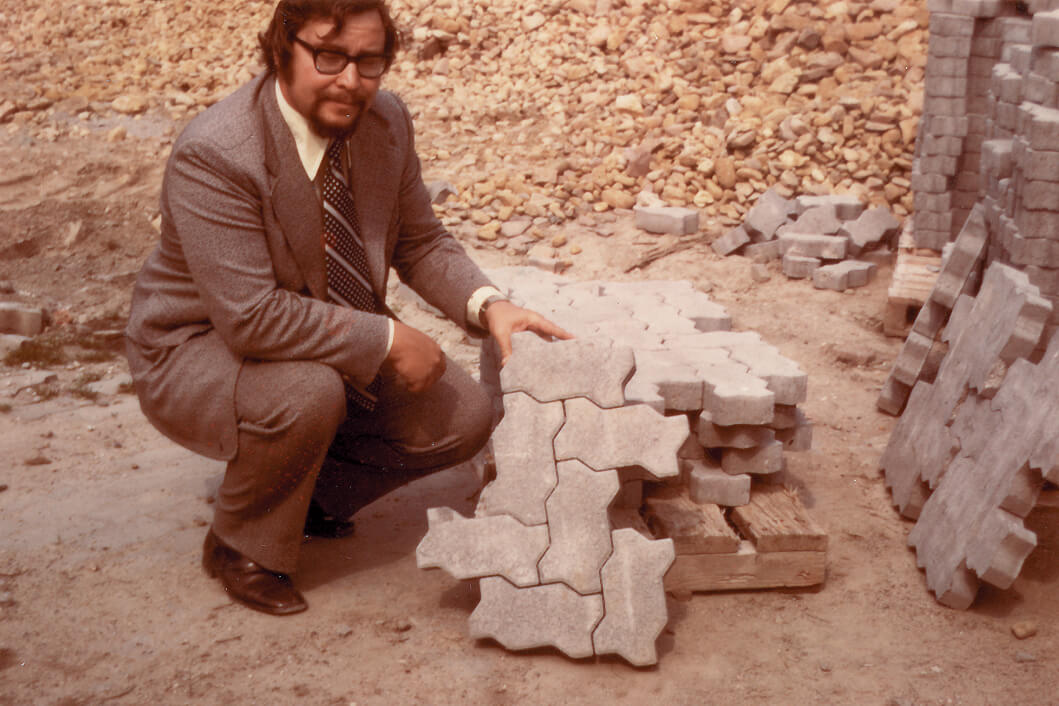 man showing a paving stone