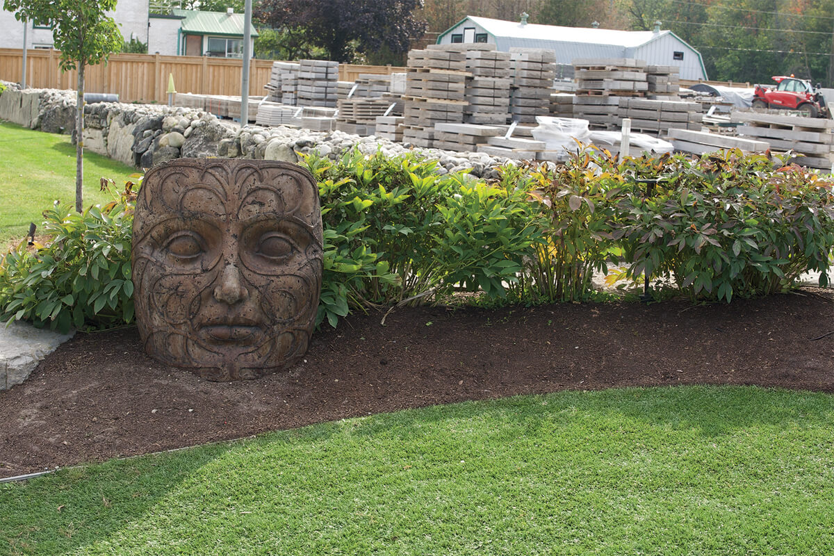 stone face in a garden