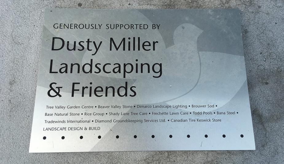 A plaque in the garden recognizes the collaborative effort spearheaded by Brian Miller.